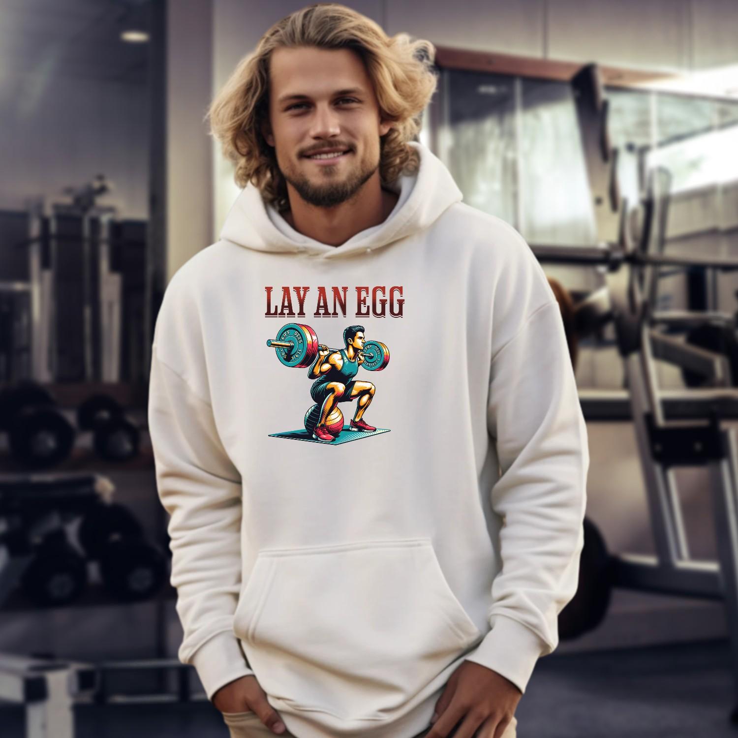 "Graphic gym hoodie featuring 'Lay an Egg' bold design, perfect for workouts and casual wear, inspiring strength and dedication."
