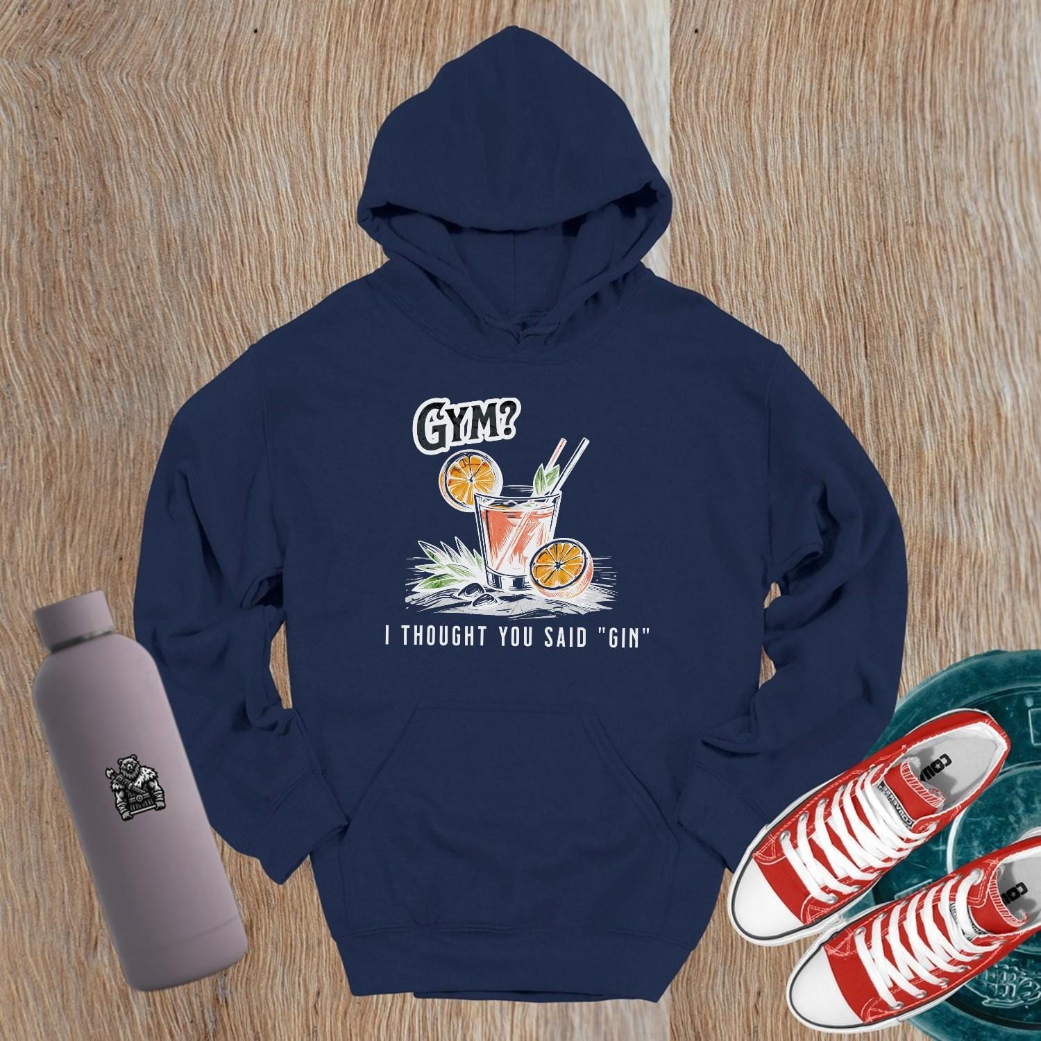 Graphic gym hoodie featuring the slogan "Gym? I thought you said 'gin.'" in playful font, perfect for fitness lovers and casual wear.