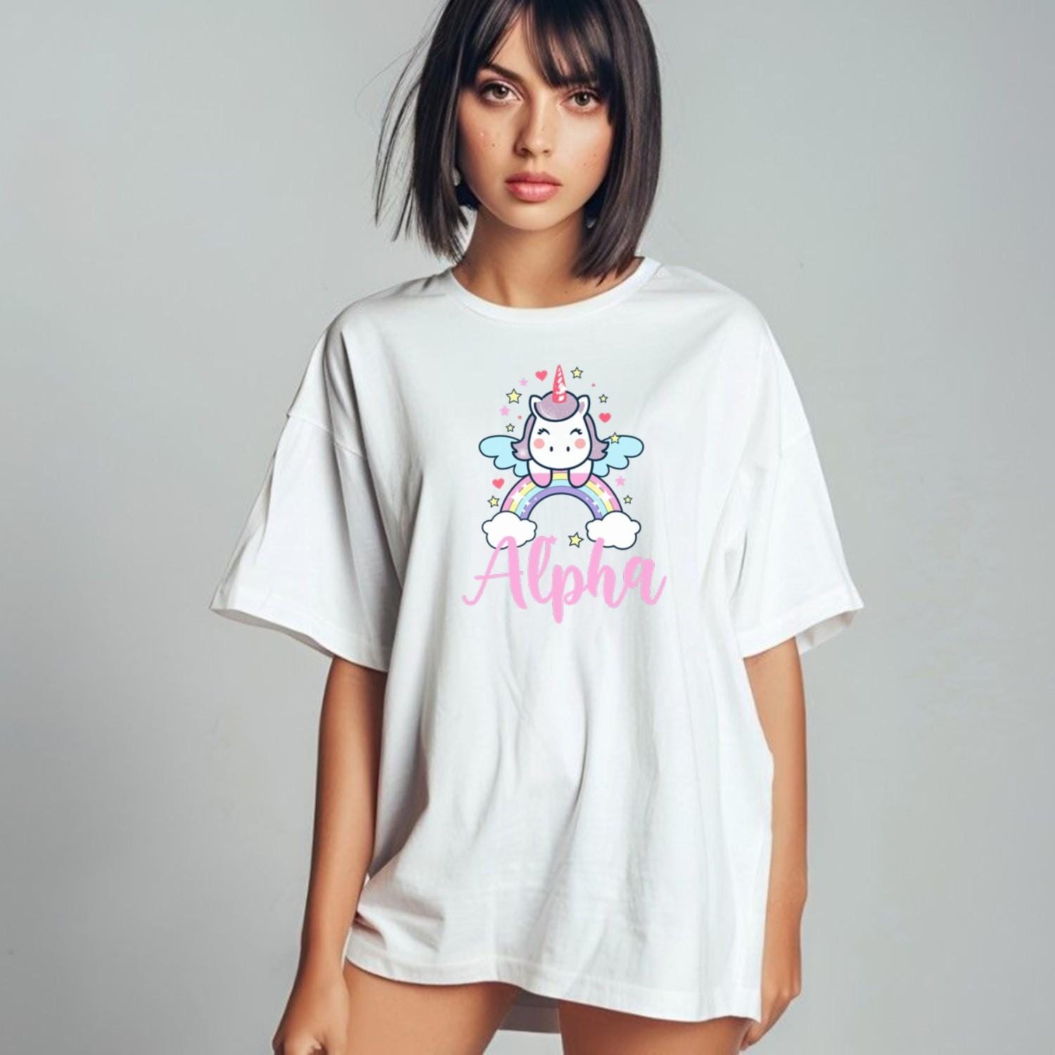 "Colorful Alpha T-shirt featuring a cute unicorn, rainbows, and sparkling stars, perfect for gym workouts and showcasing individuality."