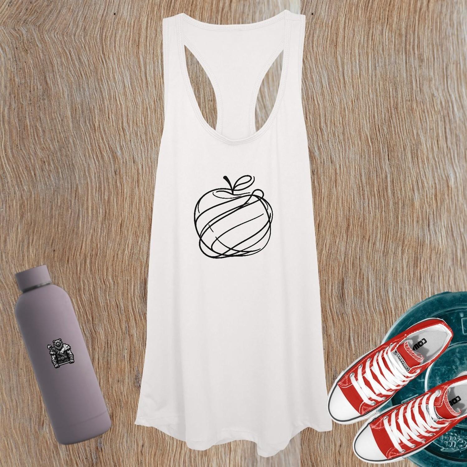"Vibrant women's tank top featuring a playful apple design, perfect for workouts and casual outings, combining style and comfort."