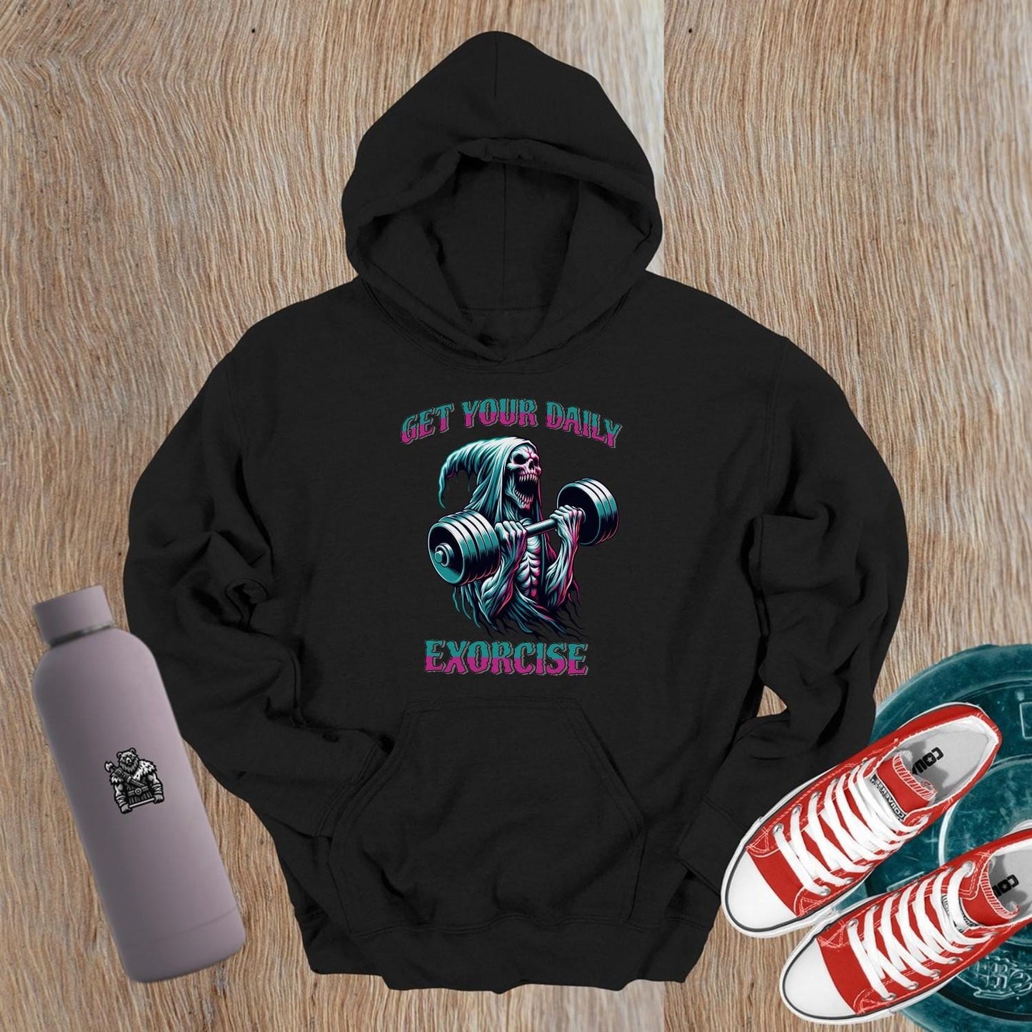 Alt text: "Striking graphic of a fierce skeleton lifting weights on a black hoodie, perfect for gym enthusiasts seeking motivation and style."