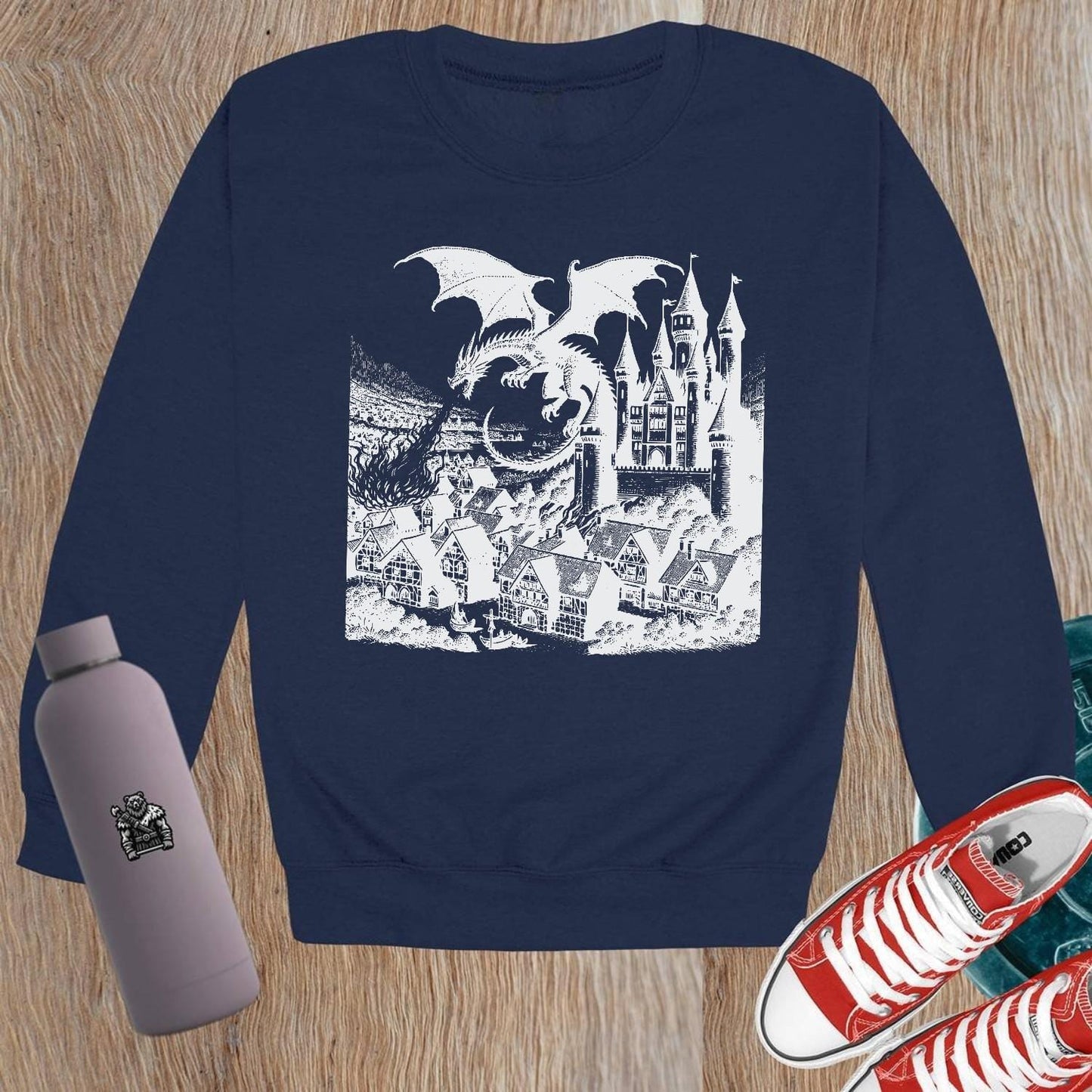 "Image of a vibrant dragon and castle graphic on a crewneck sweatshirt, perfect for gym wear and casual outings. Elevate your style!"