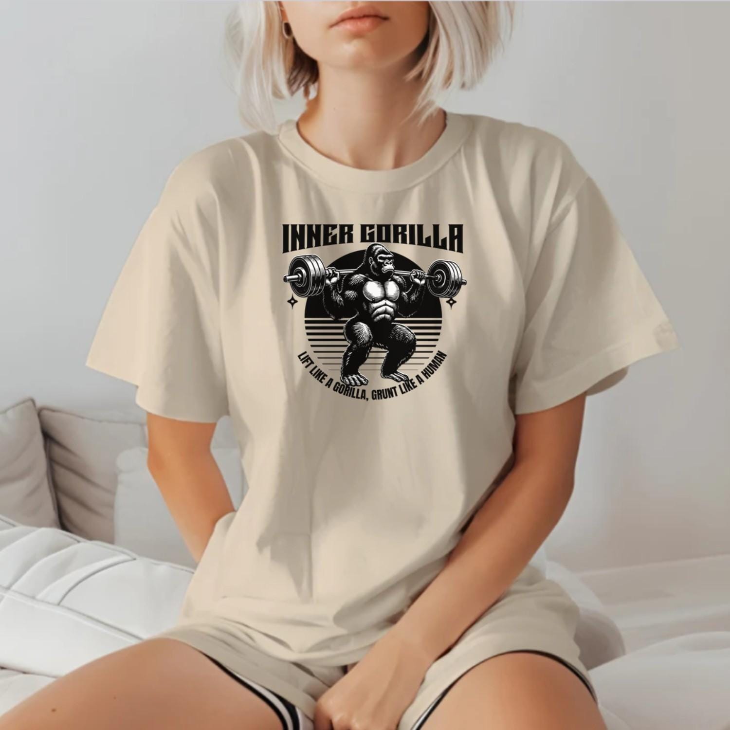 Alt text: "Gorilla Gym T-Shirt featuring a bold graphic of a powerful gorilla lifting weights, symbolizing strength and fitness motivation."