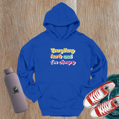 "Vibrant gym hoodie featuring the mantra 'Everything hurts and I'm Hungry,' perfect for workouts and post-gym outings, combining style, comfort, and motivation."