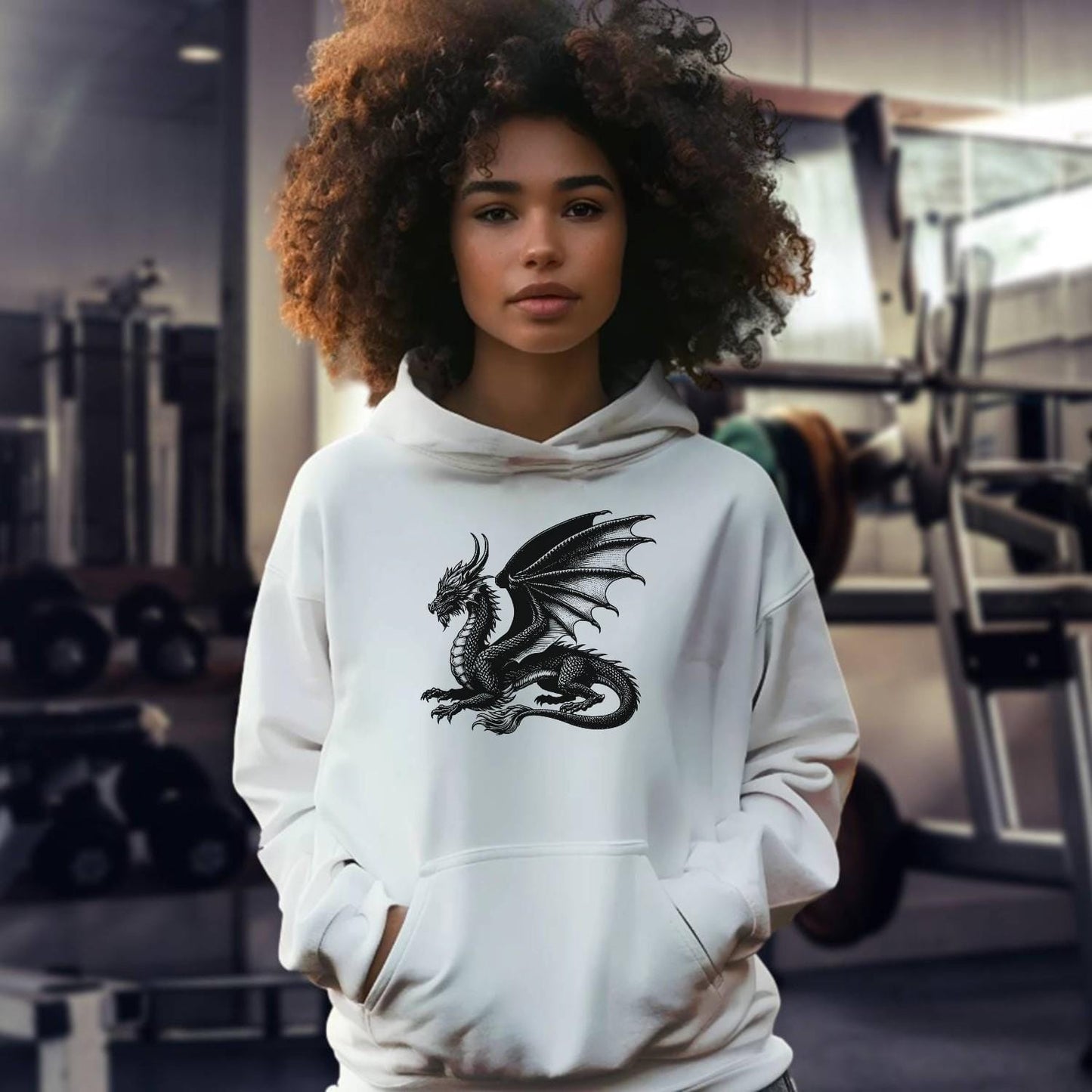 "Black gym hoodie featuring a bold strength logo, relaxed fit for comfort and style, perfect for workouts and casual wear."