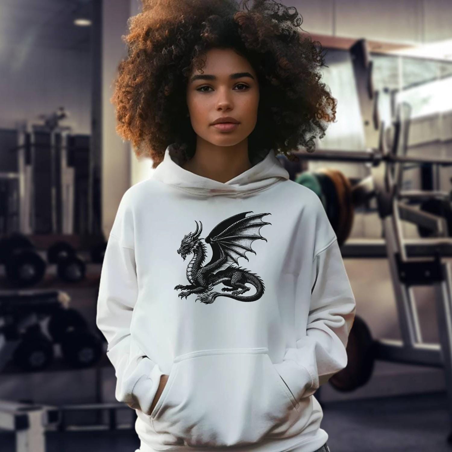 "Black gym hoodie featuring a bold strength logo, relaxed fit for comfort and style, perfect for workouts and casual wear."