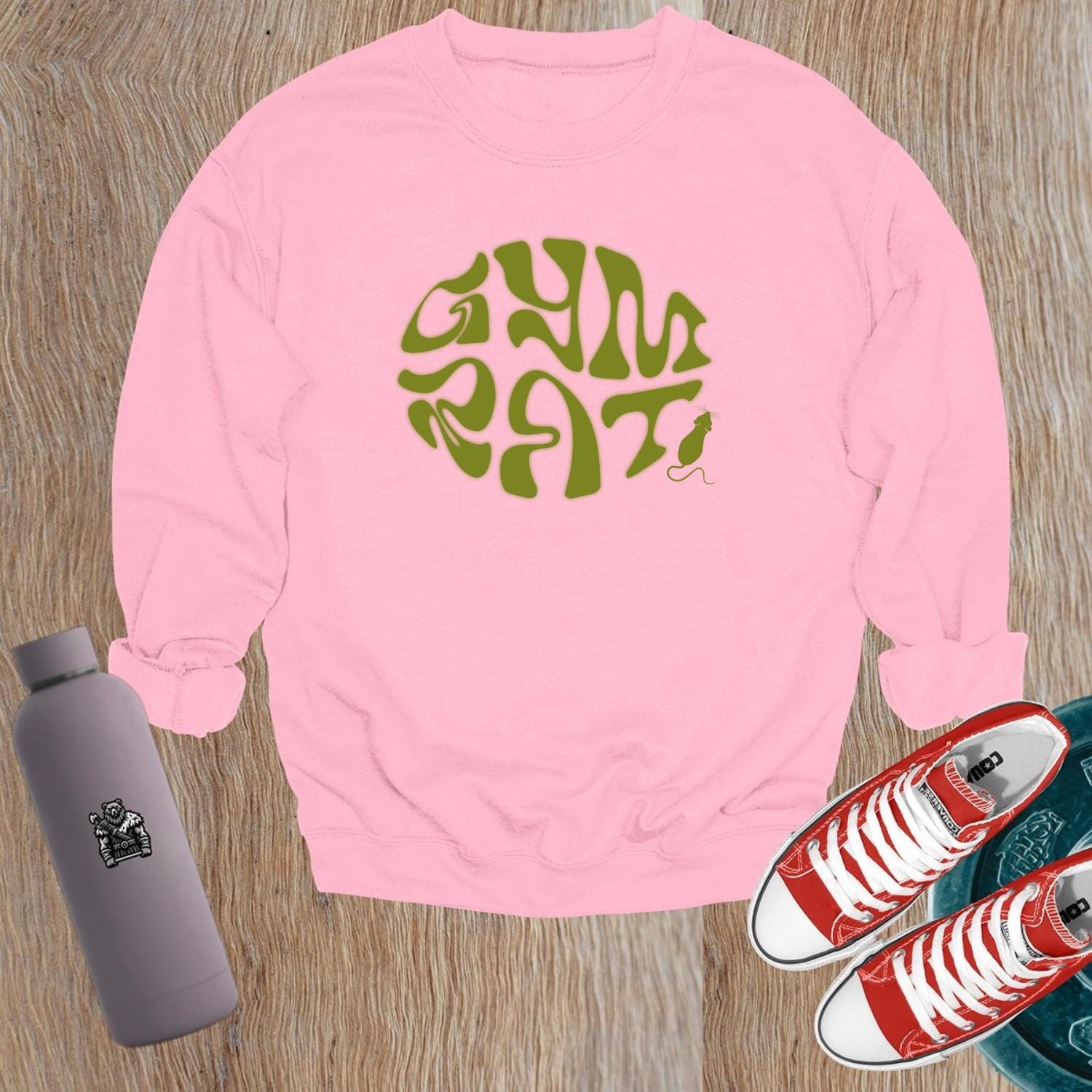 "Graphic gym crewneck sweatshirt featuring bold 'Gym Rat' design, perfect for fitness enthusiasts, blending style and comfort for workouts."