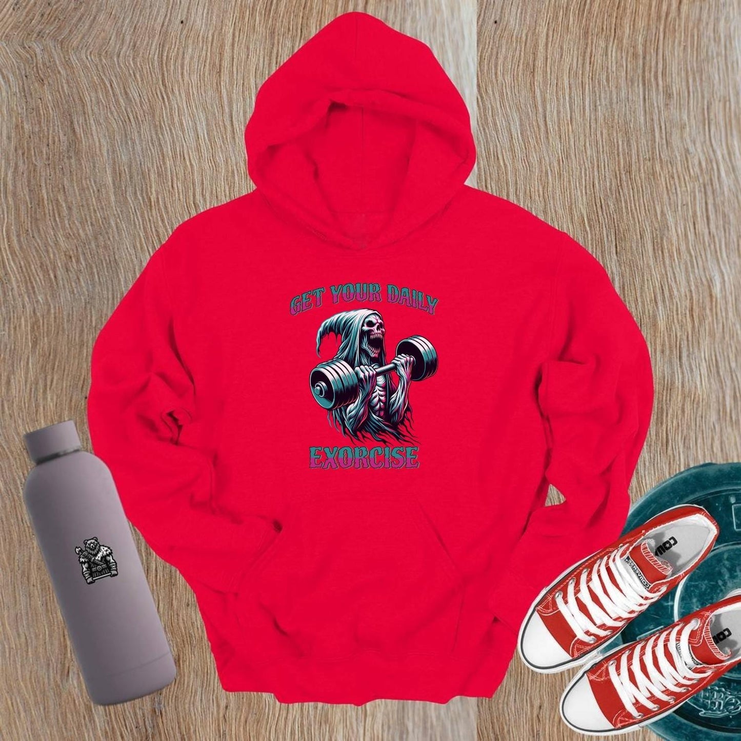 Alt text: "Striking graphic of a fierce skeleton lifting weights on a black hoodie, perfect for gym enthusiasts seeking motivation and style."