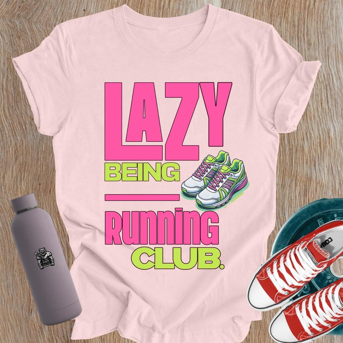 Alt text: "Fierce women's gym t-shirt featuring 'Lazy Being Running Club' bold graphic, perfect for lifting, workouts, and expressing strength."