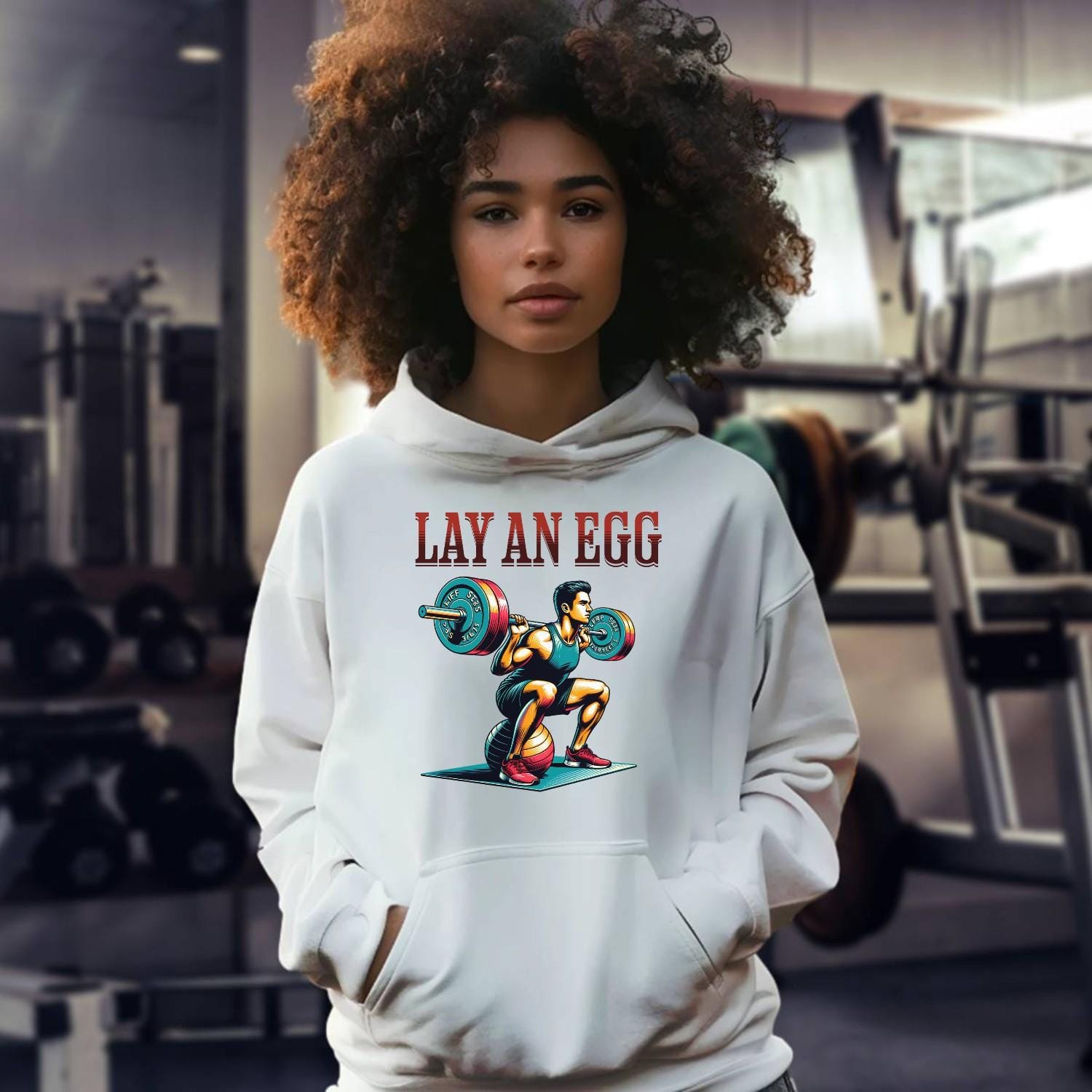 "Graphic gym hoodie featuring 'Lay an Egg' bold design, perfect for workouts and casual wear, inspiring strength and dedication."