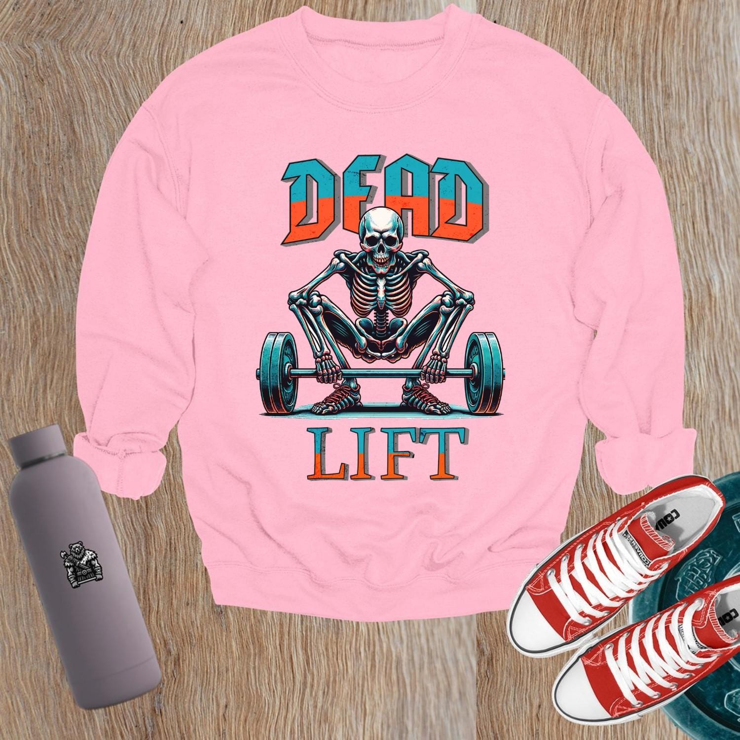"Edgy 'Dead Lift' sweatshirt featuring a bold skeleton graphic, perfect for gym workouts and casual wear, showcasing strength and style."