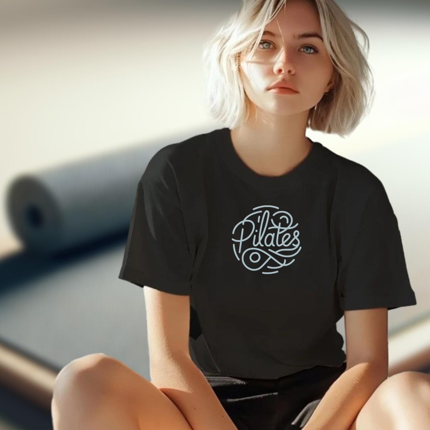"Stylish Pilates T-shirt featuring an eye-catching graphic, perfect for fitness enthusiasts, combining comfort and motivation for workouts."