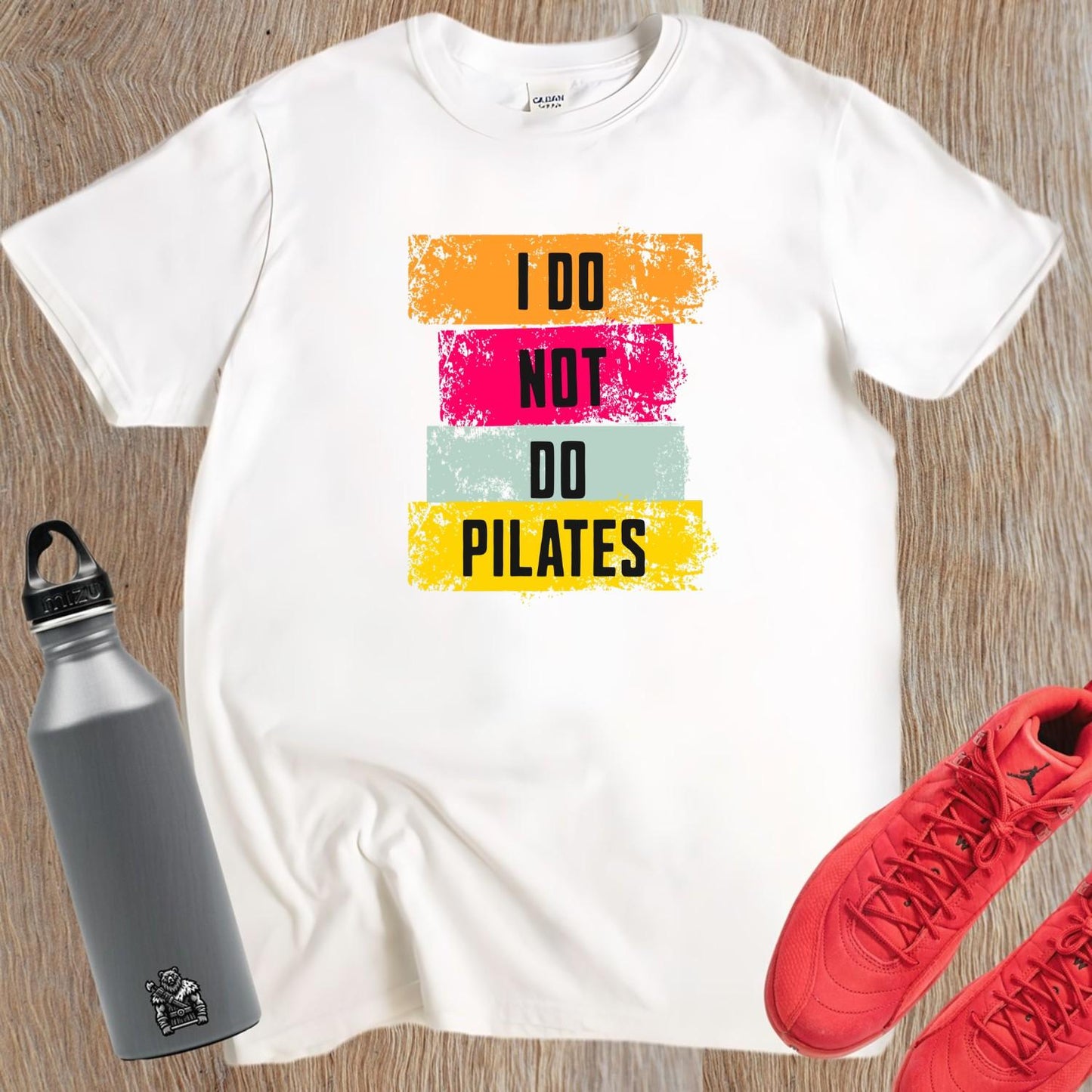 Alt text: "Black 'I Do Not Do Pilates' gym t-shirt, featuring bold white lettering, perfect for fitness enthusiasts who love weightlifting."
