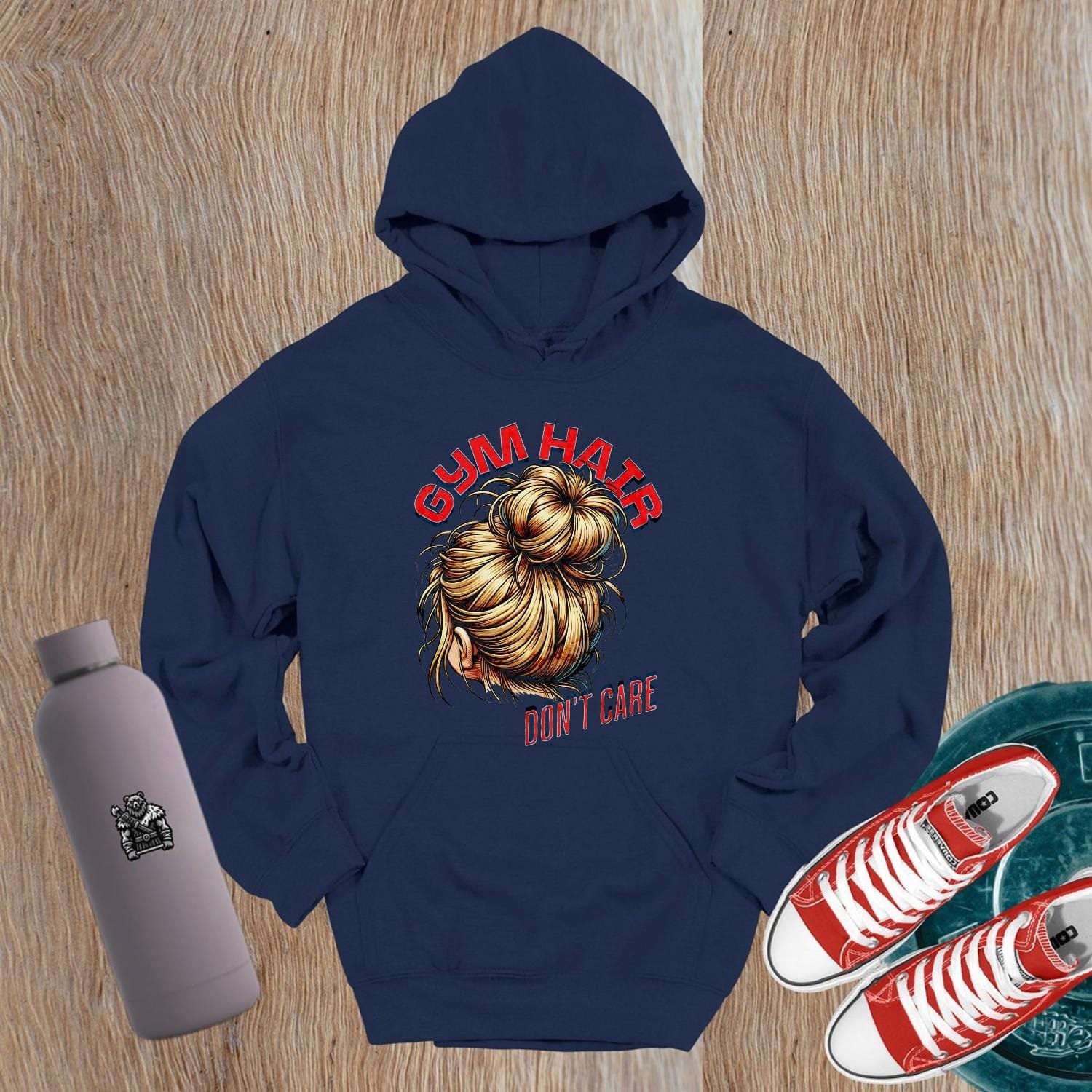 Alt text: "Stylish 'Gym Hair, Don't Care' hoodie with bold graphic, perfect for workouts and casual wear. Ideal for fitness enthusiasts."