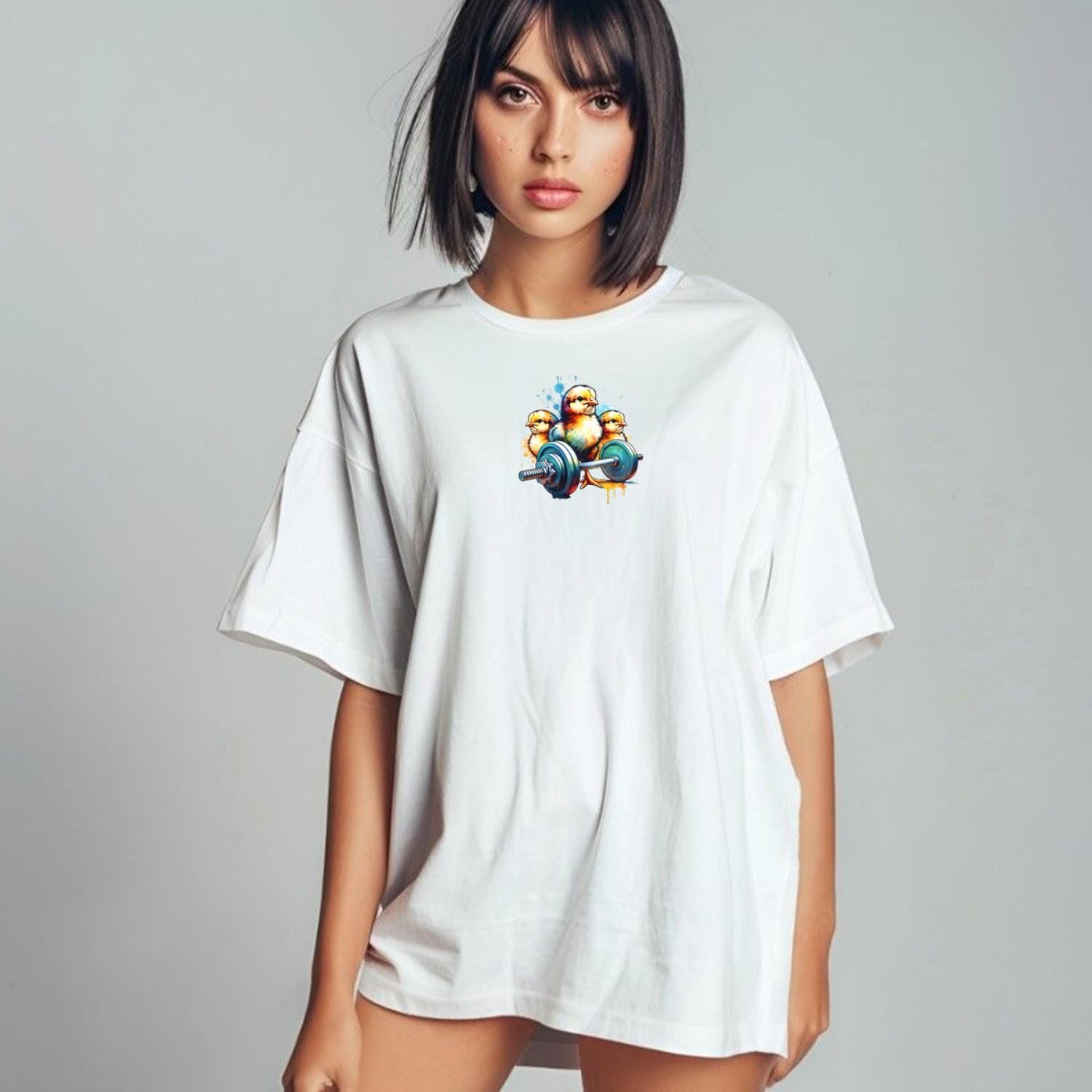 Playful gym T-shirt featuring vibrant chicks lifting weights, showcasing a fun, fierce spirit perfect for energetic workouts and fitness style.