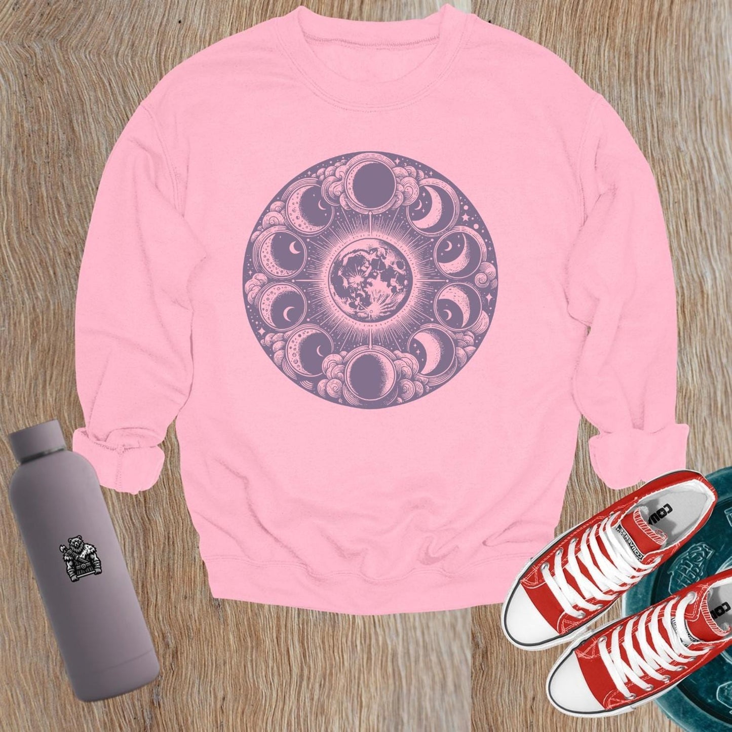 "Moon Phase Sweatshirt showcasing a celestial design with moon phases, perfect for gym workouts and yoga, blending style and comfort."