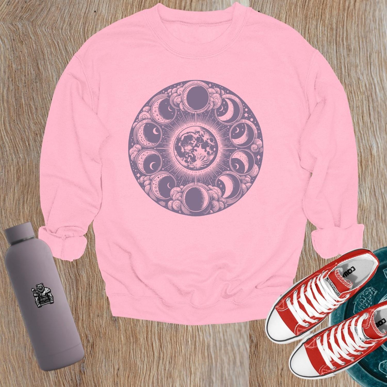 "Moon Phase Sweatshirt showcasing a celestial design with moon phases, perfect for gym workouts and yoga, blending style and comfort."