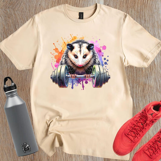 "Vibrant gym T-shirt featuring a fierce possum lifting weights, embodying strength and determination for fitness enthusiasts."