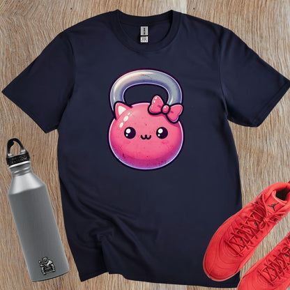"Adorable pink kettlebell T-shirt with a cute cat face and bow, perfect for gym lovers. Stylish workout gear for fitness enthusiasts."