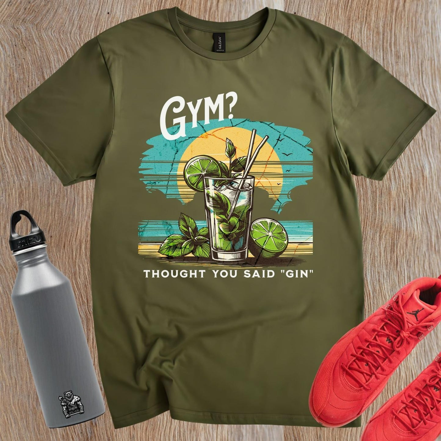 "Vibrant gym T-shirt featuring a colorful cocktail design with the playful phrase 'I thought you said “gin”!' Ideal for fitness lovers."