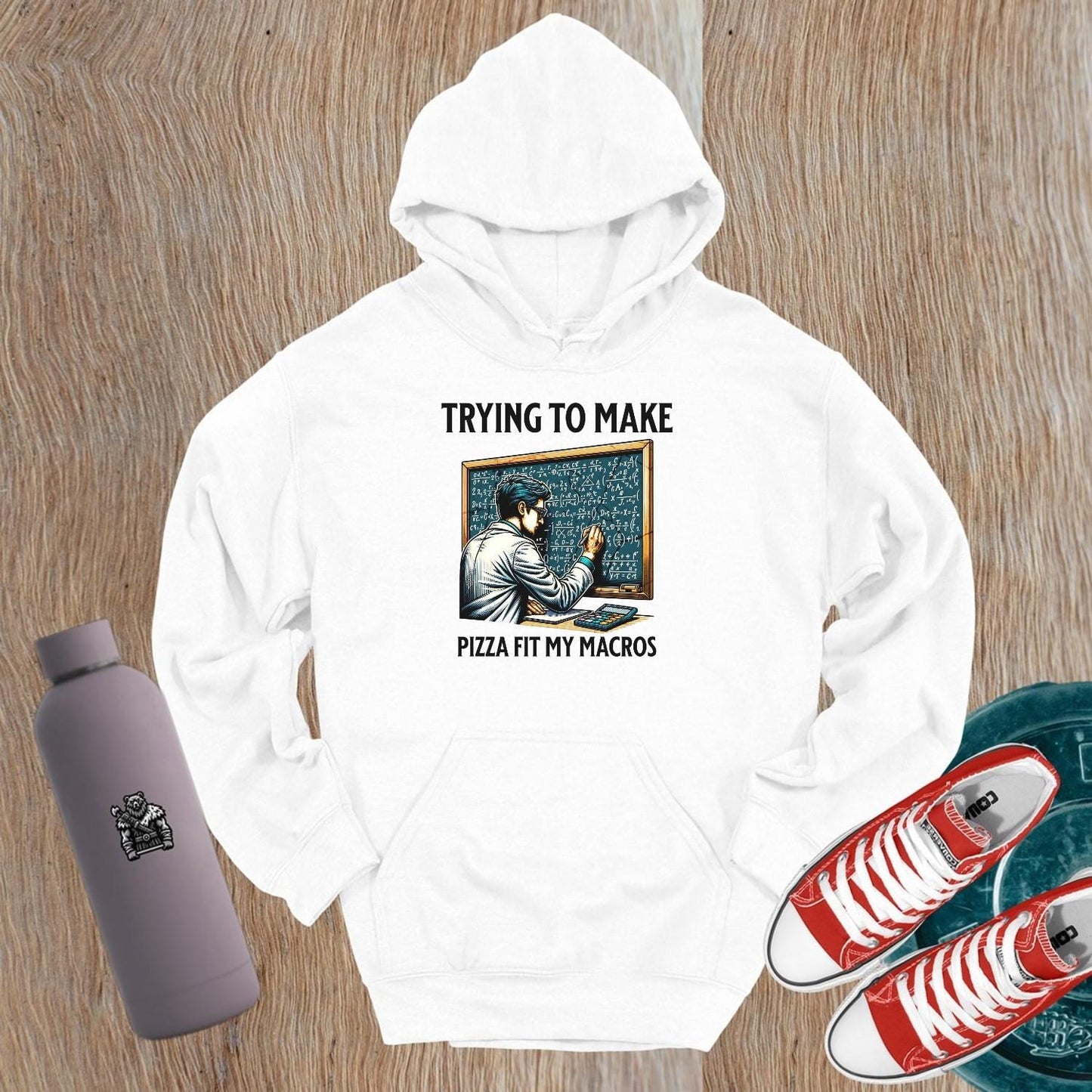 "Graphic hoodie featuring a humorous design of a fitness enthusiast calculating pizza macros, perfect for gym lovers and foodies."