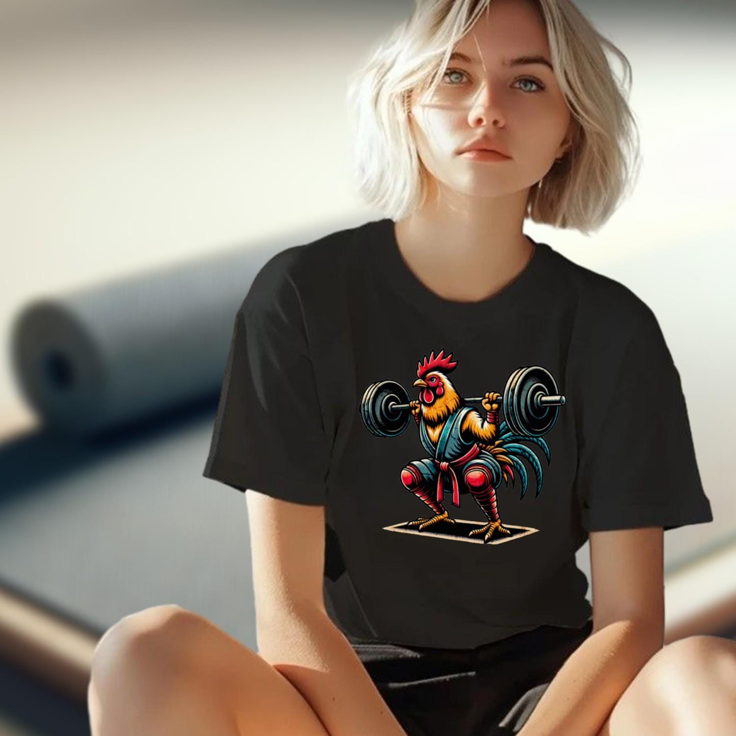 "Colorful gym T-shirt featuring a fierce rooster lifting weights, blending humor and motivation for fitness enthusiasts. 'Squat Like a Chicken' design adds playful flair to workout wear, perfect for workouts or casual outings."