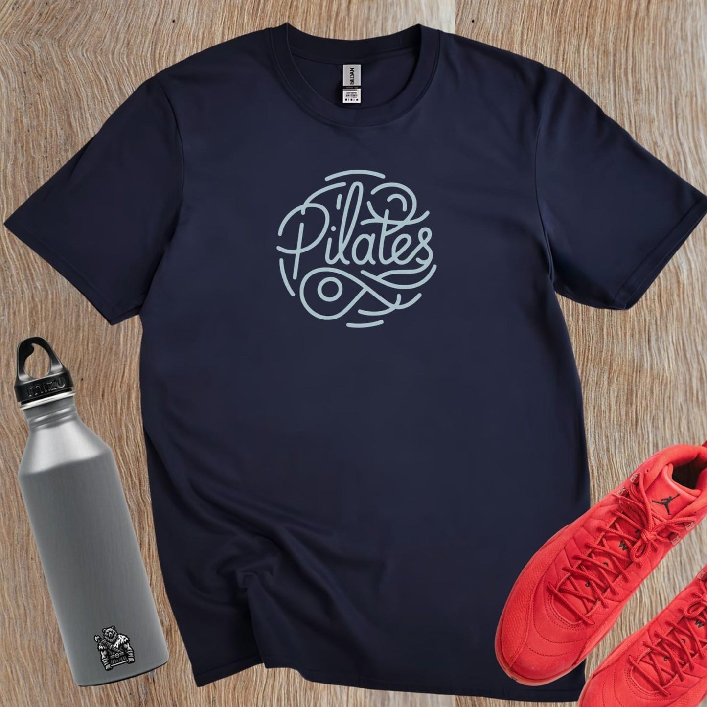 "Stylish Pilates T-shirt featuring an eye-catching graphic, perfect for fitness enthusiasts, combining comfort and motivation for workouts."