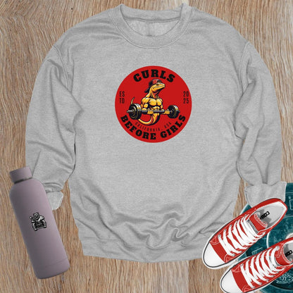Alt text: "Bold gym crewneck sweatshirt featuring a muscular lizard lifting weights with 'Curls Before Girls' slogan. Perfect for fitness enthusiasts."