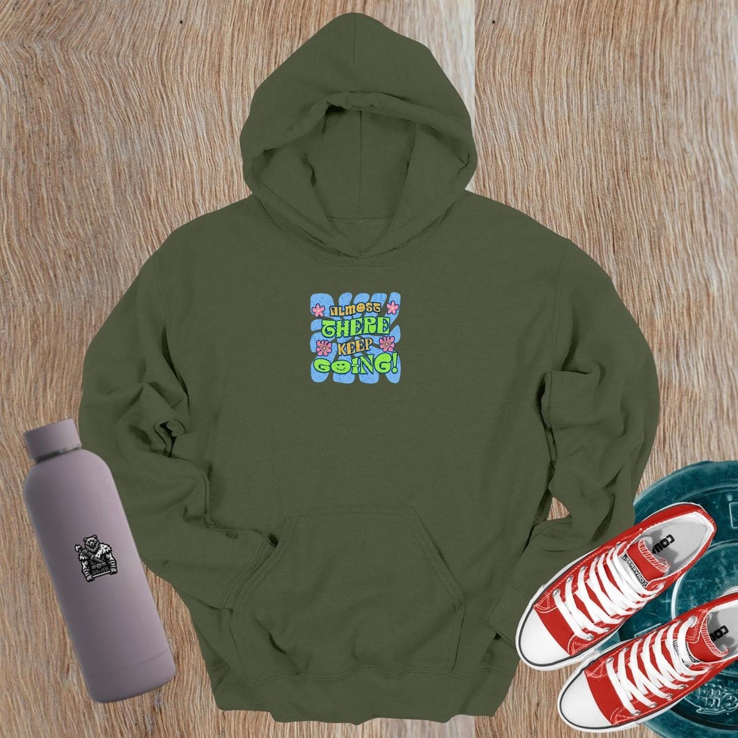 Alt text: "Vibrant gym hoodie featuring motivational 'Almost there, keep going!' graphic, perfect for workouts and post-gym style."