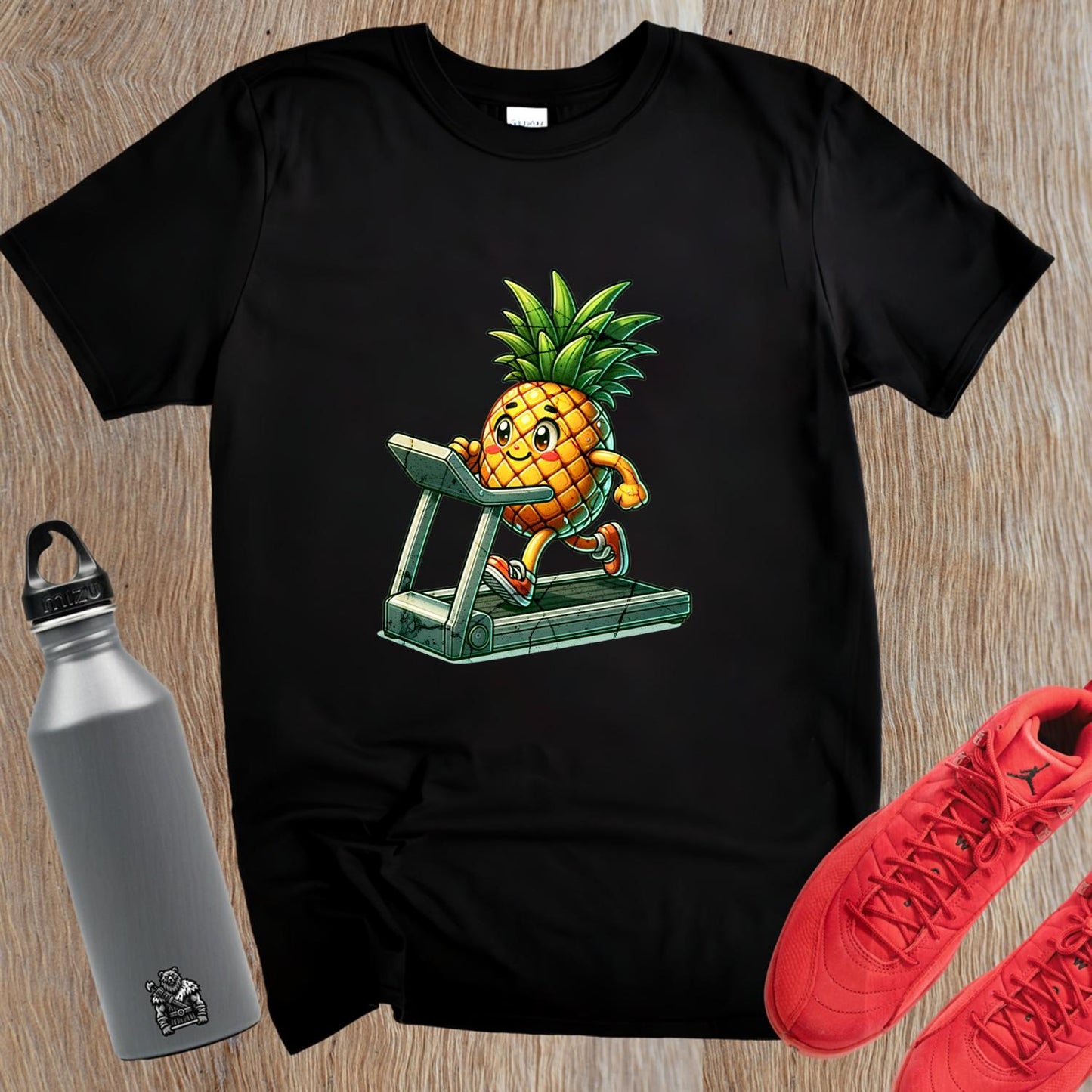 "Playful pineapple sprinting on a treadmill graphic T-shirt for gym enthusiasts; vibrant design enhances workout motivation and style."